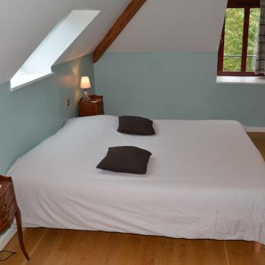Lit de la chambre d'hôtes 